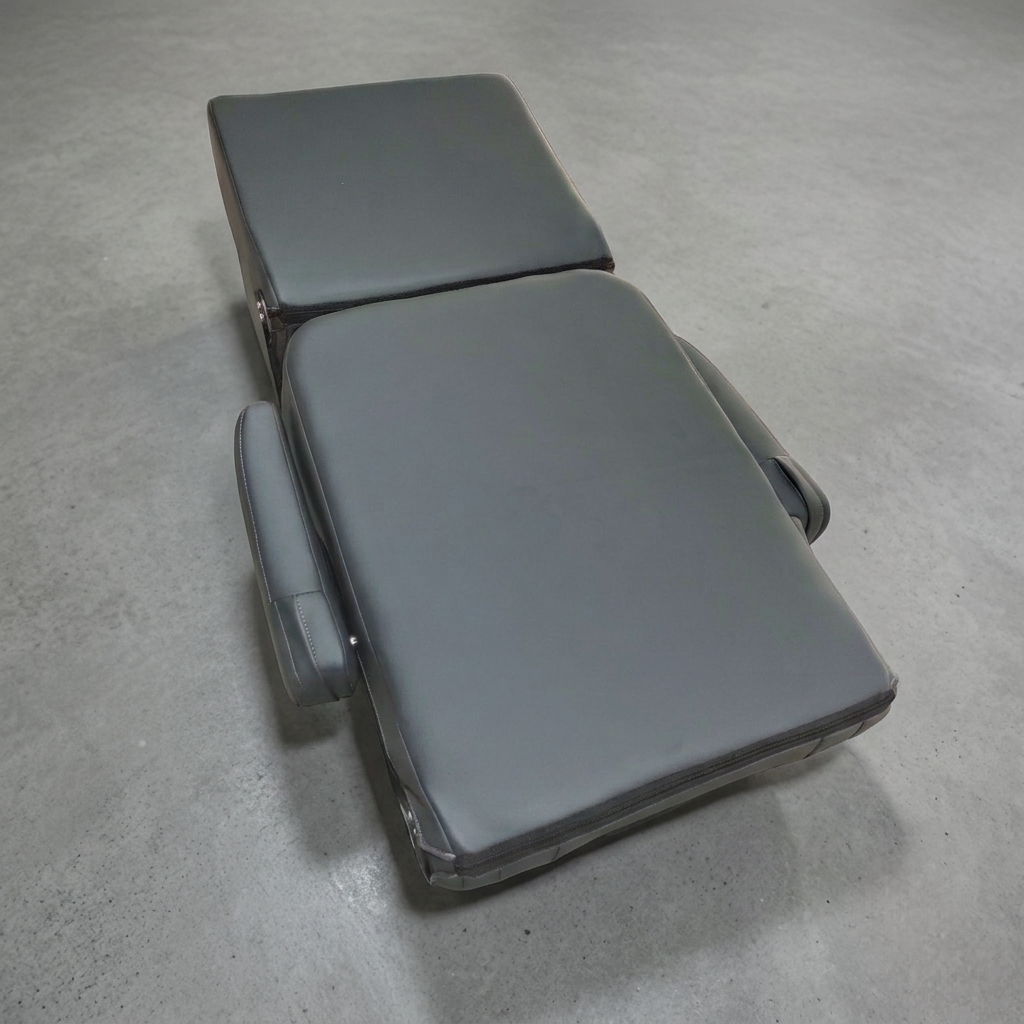 2-passenger van seat completely folded flat into a sleeping mattress surface