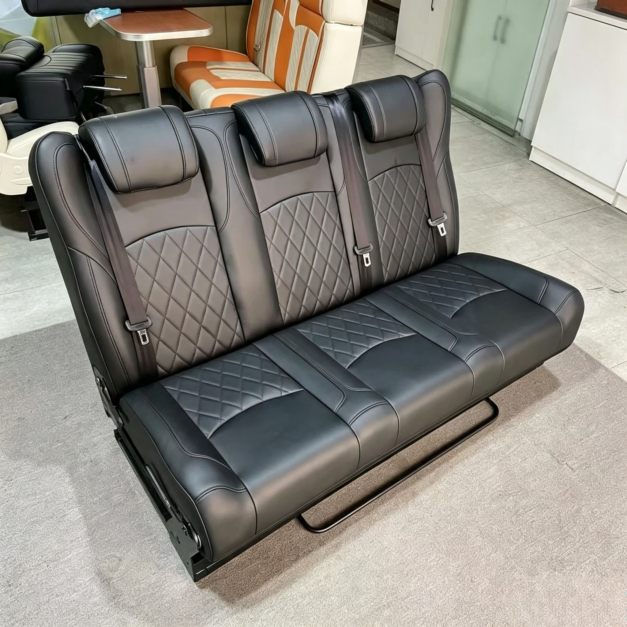 Side angle view of 3-passenger diamond stitched van seat bed